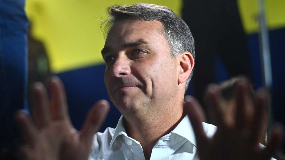 epa13285947 Brazilian presidential candidate Flavio Bolsonaro reacts during the announcement of support from former conservative Goias Governor Ronaldo Caiado for the second round of the Brazilian elections, in Goiania, Brazil, 06 October 2026. The former governor called for defeating Lula's PT (Workers' Party) in the presidential runoff, amid chants of 'minister, minister, minister' from his supporters urging him to join a potential cabinet led by the far-right senator.  EPA/Andre Borges