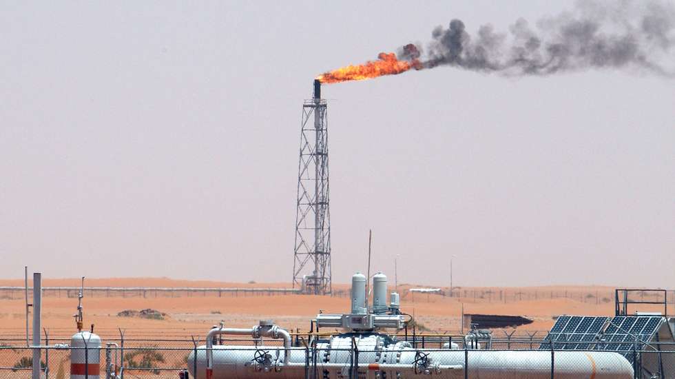 epa09087338 (FILE) - A gas flame behind pipelines in the desert at Khurais oil field, about 160 km from Riyadh, Kingdom of Saudi Arabia, 23 June 2008 (reissued 21 March 2021). Energy giant Saudi Aramco, the world&#039;s biggest oil company, says that its profits sharply fell in 2020 to 49 billion USD down from 88.2 billion USD in 2019 and 111.1 billion USD in 2018.The sharp dive came as the coronavirus pandemic hit global energy markets.  EPA/ALI HAIDER *** Local Caption *** 55598188