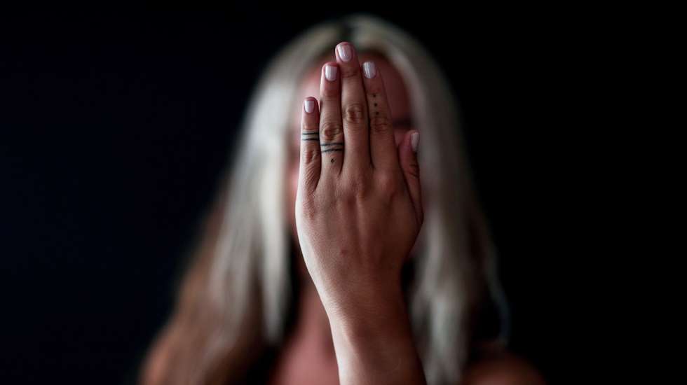 epaselect epa07839235 Turkish feminist journalist Dam Yur shows her finger tattoo representing the mythology story of Sedna or Sadduma Arna, in Istanbul, Turkey, 21 August 2019. Sedna or Sadduma Arna was a woman who was banished by her father. The father sliced off the girl's fingers and sent her to the bottom of the sea and her dismembered fingertips became the creatures of the sea. These tattoos are dedicated to girls who suffer from domestic violence and become goddesses of the sea. Turkey, a historically secular state, has undergone dramatic political changes in recent years, as President Erdogan, backed by a conservative Muslim and largely rural base, has tightened his grip on power. Multiple elections, constitutional referendums and massive popular protests based in Gezi Park and Taksim Square in 2014 have created a new generation of increasingly politicized Turks, especially in the capital city, Istanbul. These changes are reflected in popular culture, and political symbols and icons have become more prominent in the public sphere. This is also true for body art, with Turkish tattoo artists saying that the demand for political tattoos has also increased in recent years.  EPA/SEDAT SUNA  ATTENTION: This Image is part of a PHOTO SET