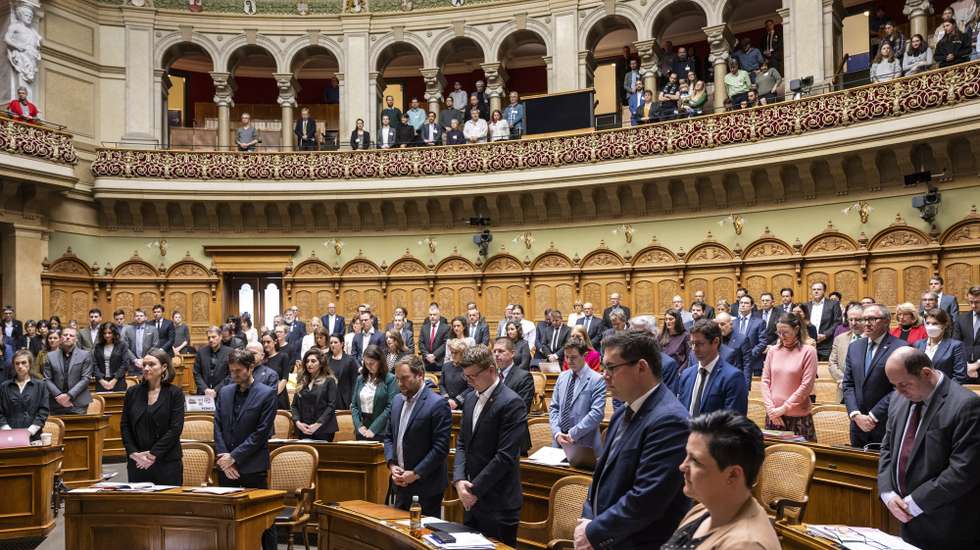 epa09791716 Members of the Grand Chamber of the Swiss Parliament observe a minute of silence to remember the victims of the war in Ukraine, on the first day of the spring session of the Swiss parliament, at the National Council in Bern, Switzerland, 28 February 2022.  EPA/ALESSANDRO DELLA VALLE