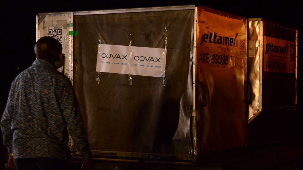 epa09056489 Workers unload a consignment of COVID-19 vaccines at the Roberts International Airport in Margibi County, Liberia, 05 March 2021 (issued 06 March 2021). Liberia received 96,000 doses of the of the AstraZeneca vaccine manufactured by the Serum Institute of India shipped as part of the COVAX initiative. The vaccine arrival in Liberia is part of the measures aimed at achieving the goal of equitable distribution of COVID-19 vaccines globally in what will be the largest vaccine procurement and supply operation in history.  EPA/AHMED JALLANZO