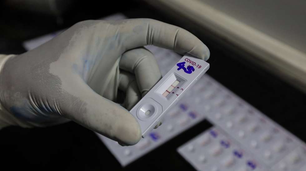 epa09310306 A Sri Lankan health officer performs COVID-19 Rapid Antigen Tests at a mobile laboratory just after collecting swabs from the community amid the coronavirus pandemic in Colombo, Sri Lanka, 29 June 2021. According to Health authorities, three new COVID-19 patients infected with highly transmissible Delta variant of COVID-19 were detected on June 28 at a construction site in Colombo. Earlier, authorities detected five patients contracted with Delta variant of SARS-Cov-2  in the Colombo city area. Sri Lanka is currently in the midst of the third wave of the COVID-19 virus pandemic and the number of cases is increasing day by day.  EPA/CHAMILA KARUNARATHNE