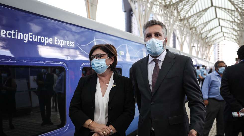 epa09443294 European Commissioner for Transports Adina Valean (L) and Portuguese Minister of Infrastructure and Housing Pedro Nuno Santos (R) moments before the train departure during the Connecting Europe Express ceremony in Gare do Oriente train station in Lisbon, Portugal, 02 September 2021.  EPA/RODRIGO ANTUNES