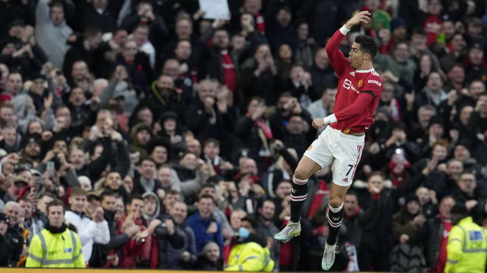 epa09819597 Manchester United's Cristiano Ronaldo celebrates after scoring the 1-0 lead during the English Premier League soccer match between Manchester United and Tottenham Hotspur in Manchester, Britain, 12 March 2022.  EPA/ANDREW YATES EDITORIAL USE ONLY. No use with unauthorized audio, video, data, fixture lists, club/league logos or 'live' services. Online in-match use limited to 120 images, no video emulation. No use in betting, games or single club/league/player publications