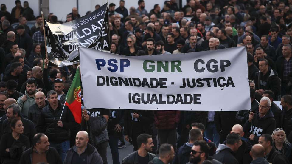 Police officers hold a banner with the words "Dignity, Justice, Equality" protest during a demonstration by the platform of PSP (Public Security Police) unions and GNR (National Republican Guard) associations for the restructuring of pay supplements and for the enhancement and dignification of professionals, Porto, Portugal, 31 January 2024.  ESTELA SILVA/LUSA