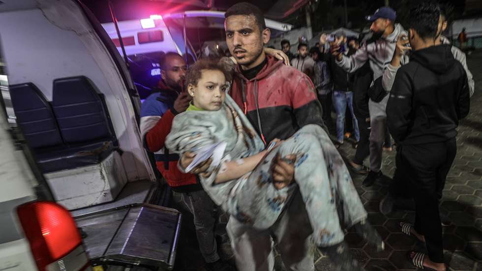 epa11773506 A wounded girl is carried to the al-Aqsa Martyrs Hospital in Deir al-Balah, central Gaza Strip, 12 December 2024. According to the Palestinian Ministry of Health in Gaza, at least 25 people were killed in an Israeli airstrike on the Nuseirat refugee camp in central Gaza Strip. More than 45,000 Palestinians and over 1,400 Israelis have been killed, according to the Palestinian Health Ministry and the Israeli Army, since Hamas militants launched an attack against Israel from the Gaza Strip on 07 October 2023, and the Israeli operations in Gaza and the West Bank which followed it.  EPA/MOHAMMED SABER