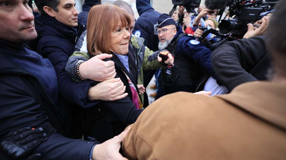 epa11784898 Gisele Pelicot (C), escorted by her lawyers Stephane Babonneau (L) and policeman arrive at the criminal court where her husband Dominique Pelicot is on trial in Avignon, South of France, 19 December 2024. Judges will hand down verdicts on 51 men in the mass rape trial in which Dominique Pelicot is accused of drugging and raping his then-wife, Gisele Pelicot as well as inviting dozens of men to rape her while she was unconscious at their home in Mazan, France, between 2011 and 2020.  EPA/GUILLAUME HORCAJUELO
