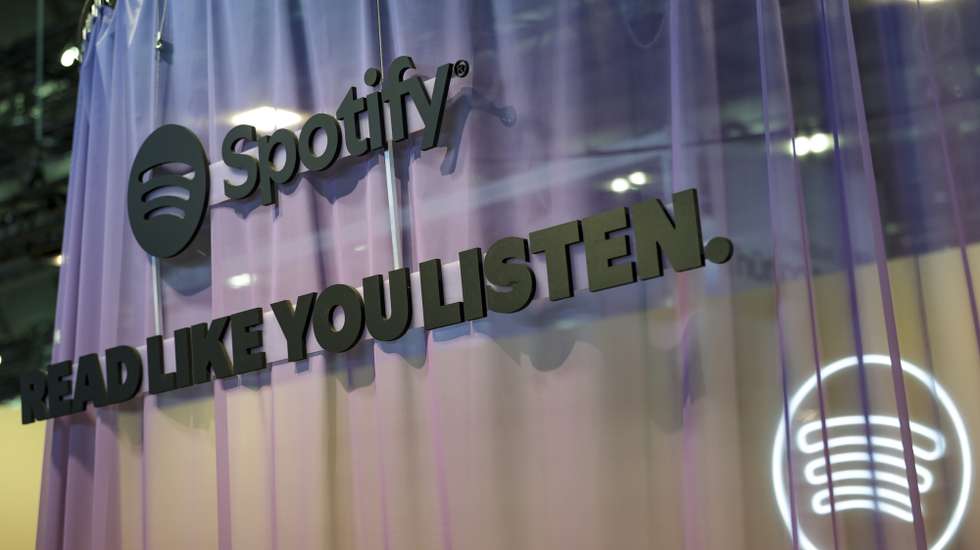epa12459782 A Spotify logo is seen at a stand at the Frankfurt International Book Fair 2025, in Frankfurt, Germany, 17 October 2025. The 77th Frankfurt Book Fair runs from 15 to 19 October 2025. This year's Guest of Honor country is the Philippines, with the motto 'The imagination peoples the air.'  EPA/CHRISTOPHER NEUNDORF