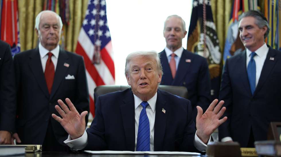 epa12693162 US President Donald Trump (C), joined by Roger Penske, chair of the Penske Corporation, Bud Denker, president of the Penske Corporation, and US Interior Secretary Doug Burgum, delivers remarks before signing an executive order in the Oval Office at the White House, Washington, DC, USA , 30 January 2026. The order aims to bring an IndyCar race to the District of Columbia in summer as part of the celebration of America’s 250th birthday.  EPA/FRANCIS CHUNG / POOL