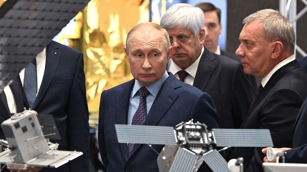 epa10941228 Russian President Vladimir Putin (L), accompanied by the Head of Russian state space corporation Roscosmos Yuri Borisov (R), visits the Rocket and Space Corporation (RSC) Energia in Korolyov, outside Moscow, Russia, 26 October 2023. The Russian rocket and space industry is moving to conveyor assembly of satellites; more than 2 thousand spacecraft are planned to be launched into low-Earth orbit by 2036.  EPA/GRIGORY SYSOEV / SPUTNIK / KREMLIN POOL MANDATORY CREDIT