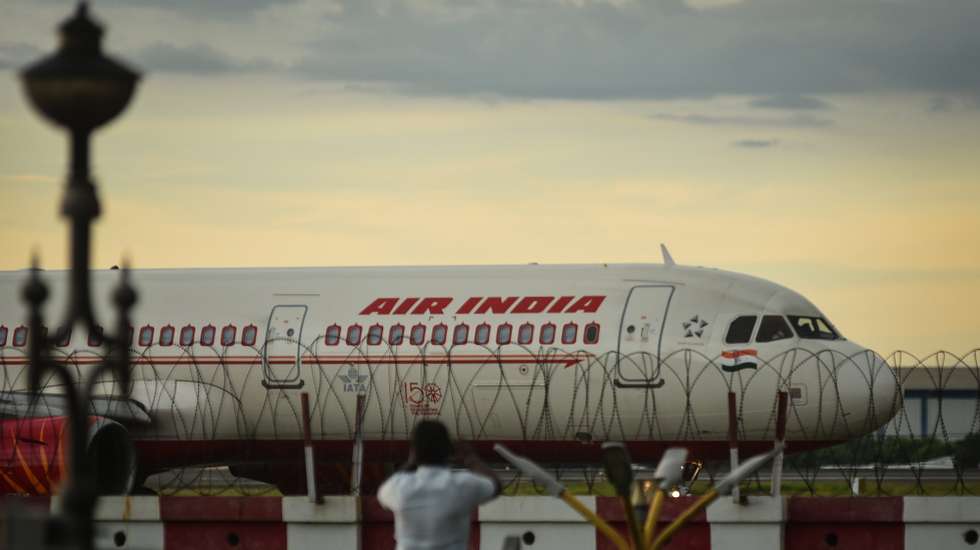 epa09515052 An Air India aircraft prepares to take off at Chennai International Airport, in Chennai, India, 09 October 2021. After 68 years, Tata Sons retake the debt-laden national carrier Air India by winning the bid with 180 billion rupees (2.4 billion US dollars). The Tata conglomerate will own a 100 percent stake in Air India.  EPA/IDREES MOHAMMED