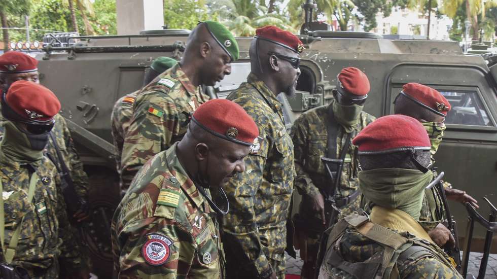 epa09468485 Guinea's special forces commander and junta president Colonel Mamady Doumbouya (C) arrives for the opening of a national consultation framework between the military junta and socio-political spheres in Conakry, Guinea 14 September 2021. Guinea's junta president Colonel Mamady Doumbouya who ousted President Alpha Conde on 05 September 2021 opened the national consultation framework between military junta and socio-political spheres as the country moves towards the next phase following the coup.  EPA/STR