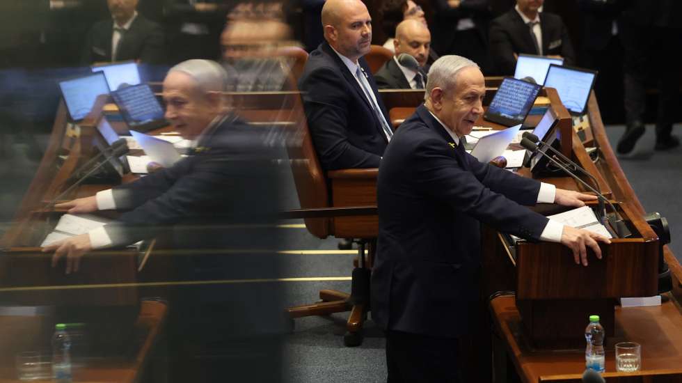 epa12516443 Israel's Prime Minister Benjamin Netanyahu speaks during a plenary session at the Knesset, the Israeli parliament in Jerusalem, 10 November 2025. The session has been initiated by the opposition demanding the establishment of a state inquiry conference to investigate the 07 October 2023 massacre.  EPA/ABIR SULTAN