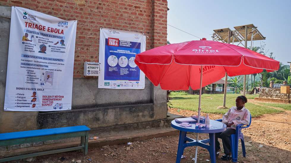 epa13075379 Posters for Ebola preventions are displayed at the hospital in Mongbwalu, Ituri, Democratic Republic of Congo, 26 June 2026 (issued 30 June 2026). Mongbwalu in Ituri, a town situated in the eastern Democratic Republic of the Congo, is where the Bundibugyo Ebola virus outbreak is believed to have started. Ituri is the most affected province, with 1,165 confirmed cases from 23 health zones, according to the country's Ministry of Health.  EPA/DIEUDONNE DIROLE