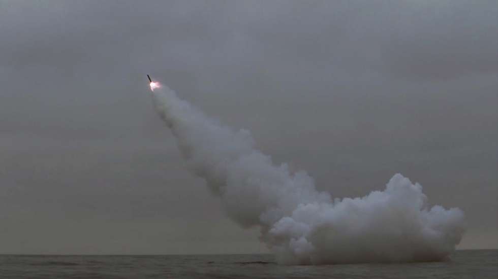 epa10519110 A photo released by the official North Korean Central News Agency (KCNA) shows a cruise missile being launched from a North Korean submarine off the east coast of North Korea, 12 March 2023 (issued 13 March 2023). According to North Korean state media, two cruise missiles were launched from a 8.24 Yongung submarine, and travelled aroud 1,500 km before striking a sea-borne target. The missile launch occured a day before the scheduled start of US-South Korean joint military drills.  EPA/KCNA   EDITORIAL USE ONLY