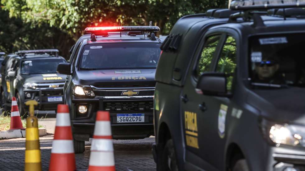 epa10398401 A convoy of national force vehicles leaves the Federal Police Academy, where the protesters who attacked the government headquarters in Brasilia are being held, in Brasilia, Brazil, 10 January 2023. Thousands of supporters of Brazil's former President Jair Bolsonaro, who do not recognize the victory of left-wing leader Luiz Inacio Lula da Silva in the presidential elections, stormed the country's congress, supreme court and presidential palace in the capital Brasilia on 08 January. At least 1,500 people have been detained after the riots, Brazil's Justice Ministry said in a statement.  EPA/ANDRE COELHO
