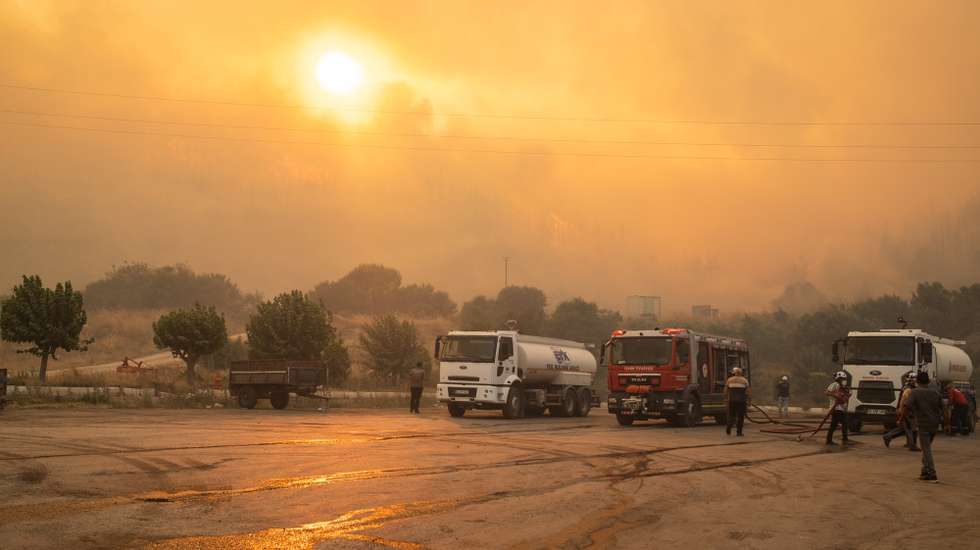 epa12207119 Firefighters try to put out the fire during the wildfires in the Seferihisar district of Izmir, Turkey, 30 June 2025. Turkish Forestry Minister Ibrahim Yumakli said the blaze in the Kuyucak and Doganbey areas of Izmir was fanned overnight by winds reaching 40–50 km/h (25–30 mph), leading to the evacuation of four villages and two neighbourhoods.  EPA/MURAT KOCABAS