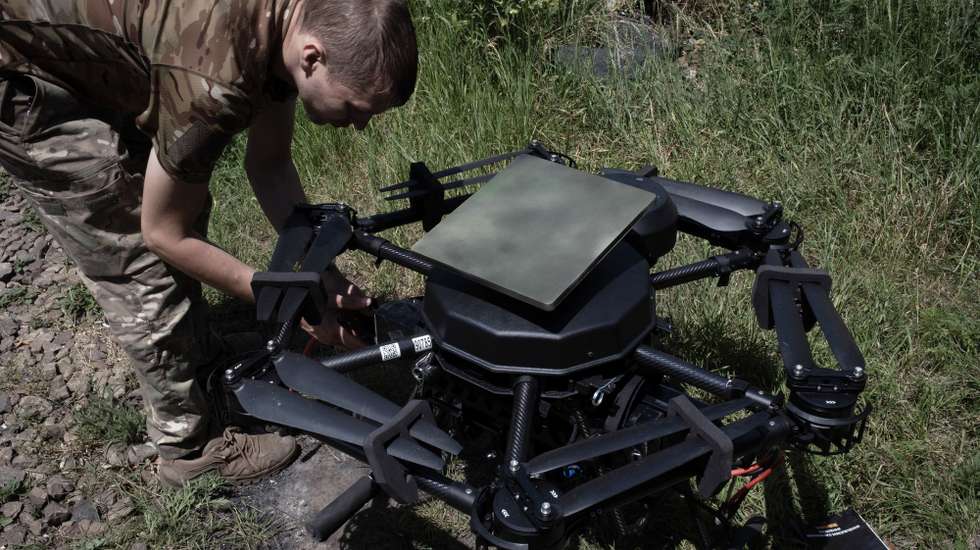 epa13068811 A Ukrainian drone operator installs a Starlink communications system on a 'Vampiro' attack drone that is due to carry out a mission at an undisclosed location near the frontline in the Donetsk region, eastern Ukraine, 26 June 2026 (issued 27 June 2026), amid the Russian invasion. Ukrainian military units frequently modify their unmanned aerial vehicles in real time to adapt to changing electronic warfare conditions on the battlefield.  EPA/MARIA SENOVILLA