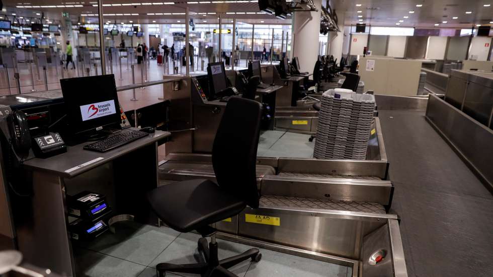 epa08968285 A view of an empty check-in desk at the Brussels Airport's departures hall in Zaventem, Belgium, 27 January 2020. The Belgian government has taken the decision to ban all non-essential travel to and from its territory, from 27 January until 01 March, to avoid the arrival of new variants of the coronavirus disease (COVID-19) in Belgium.  EPA/STEPHANIE LECOCQ