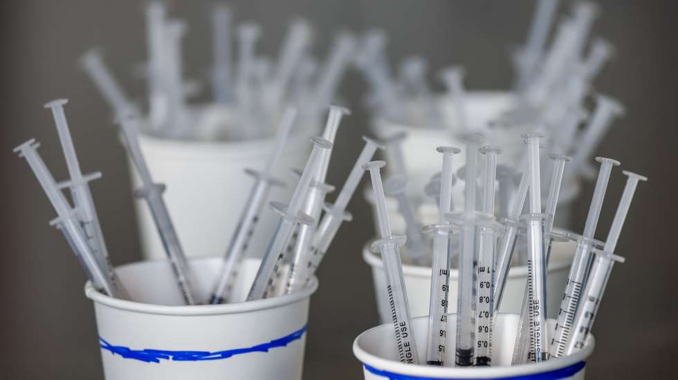 epa09105334 Vaccine syringes await distribution at the Mercedes-Benz Stadium Community Vaccination Center, a jointly run COVID-19 mass vaccination site, in Atlanta, Georgia USA, 29 March 2021. The site, which has averaged more than 8,500 shots per day since its opening to the general public, is jointly operated by the Federal Emergency Management Agency, the Georgia Emergency Management Agency and Fulton County Government.  EPA/ERIK S. LESSER