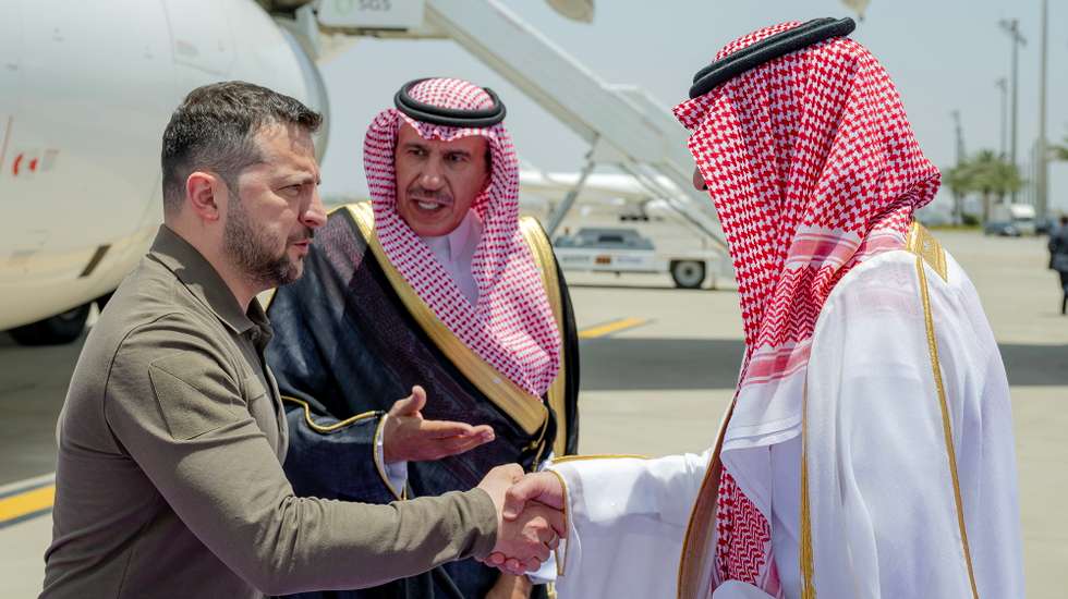 epa10638696 A handout photo made available by the Saudi Press Agency (SPA) shows Deputy Governor of Saudi Arabia's Makkah Region, Prince Badr bin Sultan bin Abdulaziz Al Saud (R) greeting Ukrainian president Volodymyr Zelensky upon his arrival to attend the 32nd Arab League summit, in Jeddah, Saudi Arabia, 19 May 2023. Zelensky is on his first-ever visit to Saudi Arabia.  EPA/SAUDI PRESS AGENCY HANDOUT  HANDOUT EDITORIAL USE ONLY/NO SALES