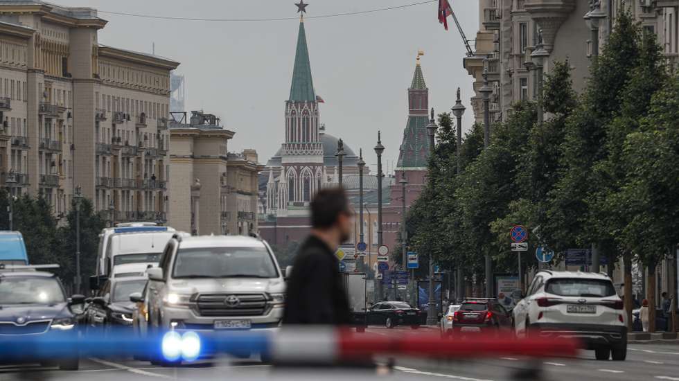 epa10718889 A man crosses a street in front of the Moscow Kremlin, in downtown Moscow, Russia, 30 June 2023. On 24 June, counter-terrorism measures were enforced in Moscow and other Russian regions after (PMC) Wagner Group Chief Prigozhin claimed that his troops had occupied the building of the headquarters of the Southern Military District in Rostov-on-Don, demanding a meeting with Russia's defense chiefs. Belarusian President Lukashenko, a close ally of Putin, negotiated a deal with Wagner chief Prigozhin to stop the movement of the group's fighters across Russia. Prigozhin, after announcing Wagner fighters' halt of their march on Moscow and retreat to their field camps, left Russia for Belarus.  EPA/MAXIM SHIPENKOV