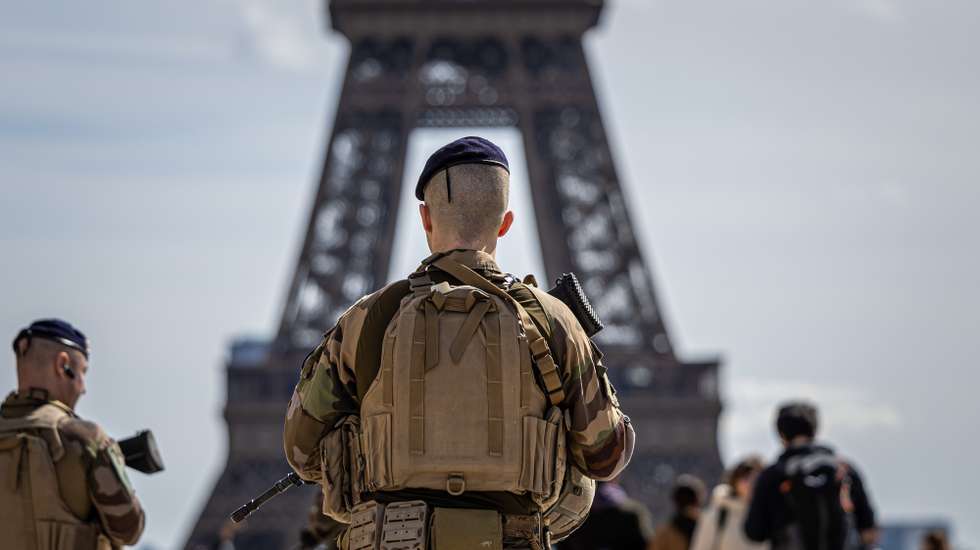 epa11242812 French soldiers patrol near the Eiffel Tower as part of the national security plan 'Vigipirate', in Paris, France, 25 March 2024. The French government decided to increase the security alert system 'Vigipirate' to the highest level after Islamic State (IS) group claimed responsibility for the attack in Moscow and the threats weighing on France, Prime Minister Gabriel Attal said in a post on social media platform X (formerly Twitter) on 24 March.  EPA/CHRISTOPHE PETIT TESSON