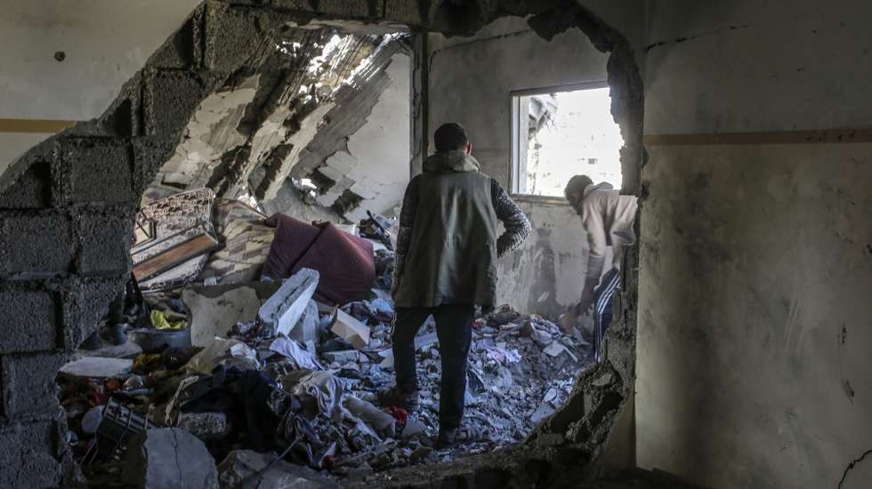 epa11970914 Palestinians inspect a destroyed area of Al Tabien school following Israeli airstrikes in Gaza City, 18 March 2025. The Israeli forces on 18 March confirmed they were carrying out 'extensive strikes' on targets in the Gaza Strip, following an Israeli prime minister's statement which ended the ceasefire in place since 19 January. According to provisional figures released by the Palestinian Health Minister, more than 250 people were killed in a series of overnight strikes in the Gaza Strip, with more bodies still waiting to be recovered from under the rubble.  EPA/MOHAMMED SABER