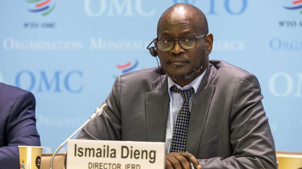 epa11652662 Ismaila Dieng, Director IERD, talks to the media about WTO's 'Global Trade Outlook and Statistics October Update' during a press conference at the headquarters of the World Trade Organization (WTO) in Geneva, Switzerland, 10 October 2024.  EPA/MARTIAL TREZZINI