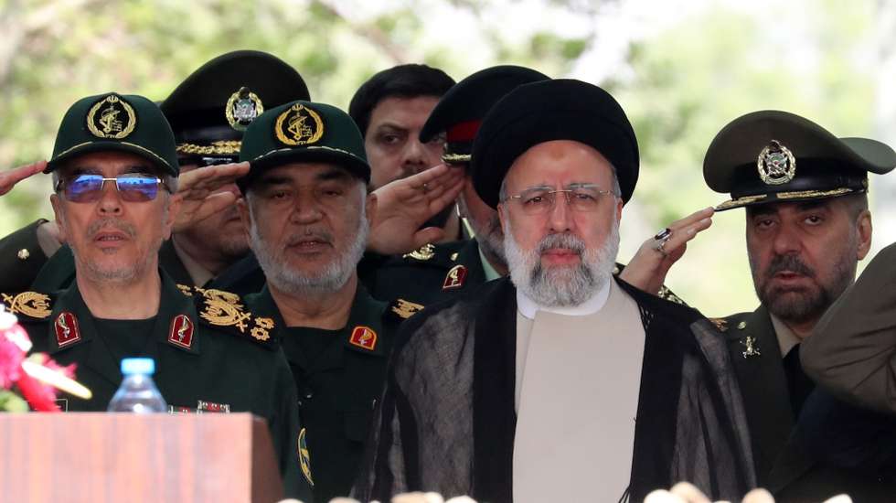 epaselect epa11283751 Iranian President Ebrahim Raisi (3-L) flanked by Iranian IRGC and Army generals arrives during the annual Army Day at a military base in Tehran, Iran, 17 April 2024. According to Iranian state media, Raisi described the recent attack launched towards Israel as 'limited' and 'punitive', adding that any act of aggression against Iran will be dealt with a 'powerful and fierce' response. Iran's Islamic Revolutionary Guards Corps (IRGC) launched drones and rockets towards Israel late on 13 April.  EPA/ABEDIN TAHERKENAREH
