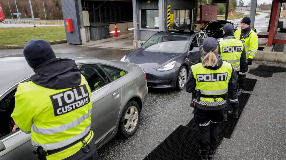 epa08297516 Norwegian Customs and Police officers at the border between Norway and Sweden in Svinesund, Norway, 16 March 2020. Norway has introduced strict border control due to the coronavirus crisis. Several European countries have closed borders, schools and public facilities, and have cancelled major sports and entertainment events in order to prevent the spread of the coronavirus SARS-CoV-2 which causes the Covid-19 disease.  EPA/VIDAR RUUD  NORWAY OUT