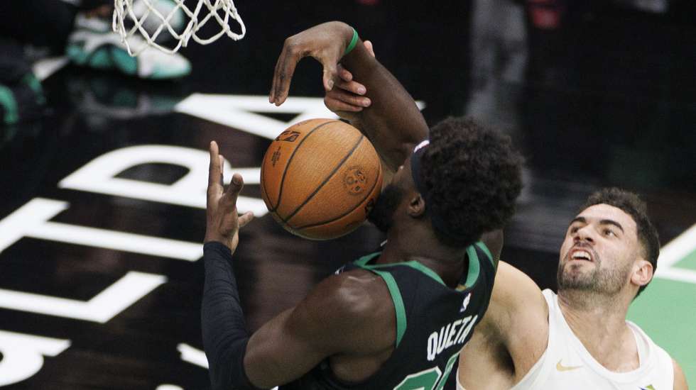 epa11730145 Boston Celtics center Neemias Queta (L) grabs a rebound against Cleveland Cavaliers forward Georges Niang during the first half of an NBA Cup tournament game in Boston, Massachusetts, USA, 19 November 2024.  EPA/CJ GUNTHER SHUTTERSTOCK OUT