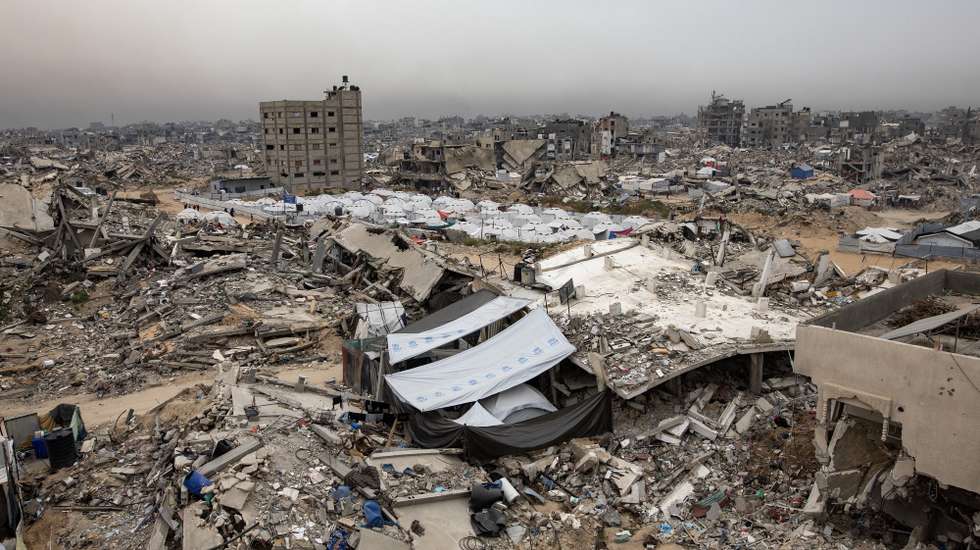 epa12018087 A camp for internally displaced Palestinians, which was set up by the HHO Foundation, is surrounded by the rubble of destroyed buildings in the Jabalia refugee camp, northern Gaza Strip, 08 April 2025. According to the UN, at least 1.9 million people (or nine in ten people) across the Gaza Strip are internally displaced, including people who have been repeatedly displaced. Since October 2023, only about 11 percent of the Gaza Strip has not been placed under Israeli-issued evacuation orders, the UN aid coordination office OCHA said.  EPA/HAITHAM IMAD