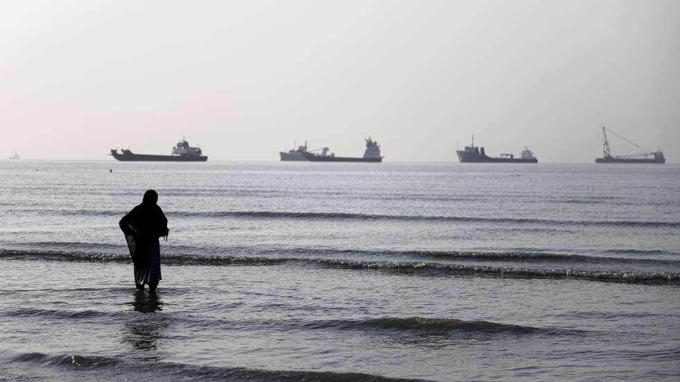 epa13009259 A handout photo made available by Isna News Agency shows an Iranian woman watching cargo ships stuck in the Strait of Hormuz, along the coast of Bandar Abbas, in southern Iran, 01 June 2026. According to Iranian state media, the military's central command warned all vessels to secure Islamic Revolution Guards Corps (IRGC) Navy clearance to pass through the strait or face maritime security risks.  EPA/AMIRHOSSEIN KHORGOOEI/ ISNA NEWS AGENCY HANDOUT RESTRICTIONS: NO Access Israel Media/Persian Language TV Stations Outside Iran/Strictly No Access BBC Persian/VOA Persian/Manoto TV/Iran International TV. (As mandated by Iran's Directorate General for Foreign Media) -- HANDOUT EDITORIAL USE ONLY/NO SALES