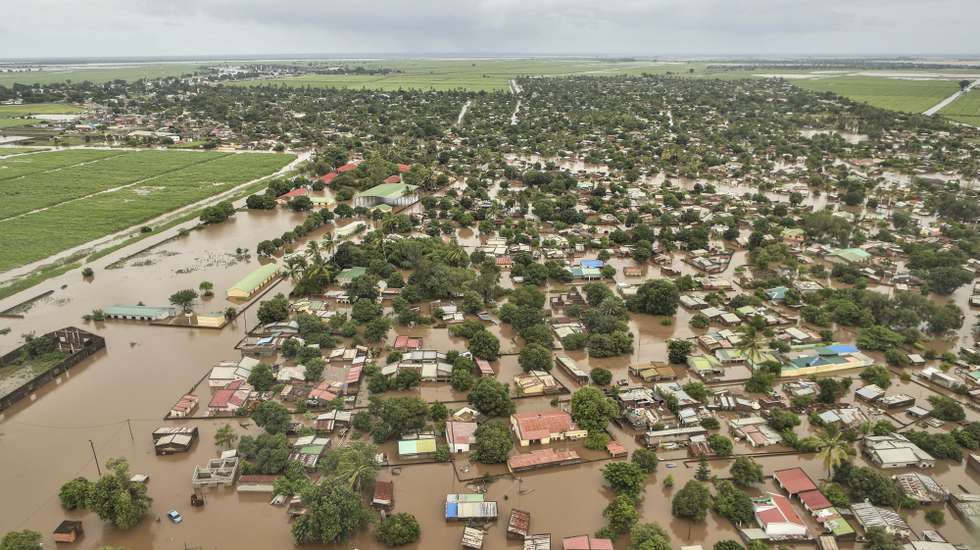 epa12664693 An aerial view shows the flooded 03 February neighbourhood between the Maputo and Gaza regions, Maputo, Mozambique, 20 January 2026. Rescue efforts continue for hundreds of families cut off by flooding, with some taking refuge on rooftops, car roofs, or in treetops in southern Mozambique after days of near-continuous rain that has also forced dams, including some in neighbouring countries, to increase water releases.  EPA/LUISA NHANTUMBO