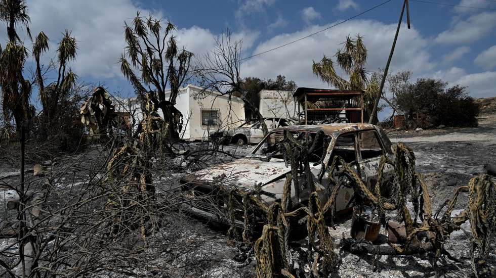 epa13106751 Burnt cars after Los Gallados fire next to Beda village, Almeria, southern Spain, 12 July 2026. The fire of Los Gallardos (Almeria) has left 12 people dead and at least 7,000 hectares burnt.  EPA/CARLOS BARBA