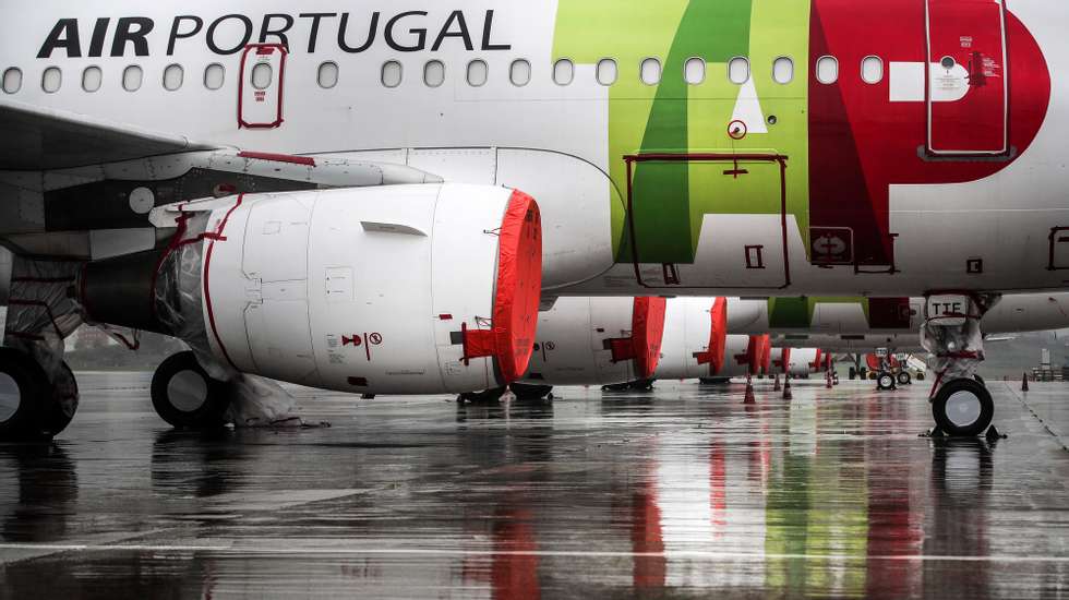 epa08352903 TAP aircraft engines cover with plastic foil remain grounded at Humberto Delgado airport closed for passenger traffic as part of the exceptional traffic measures to combat the epidemiological situation of Covid-19, in Lisbon, Portugal, 09 April 2020. All national airports are closed until 24.00 on the 13th of April to avoid external traffic to Portugal or from Portugal to abroad.  EPA/MÃRIO CRUZ