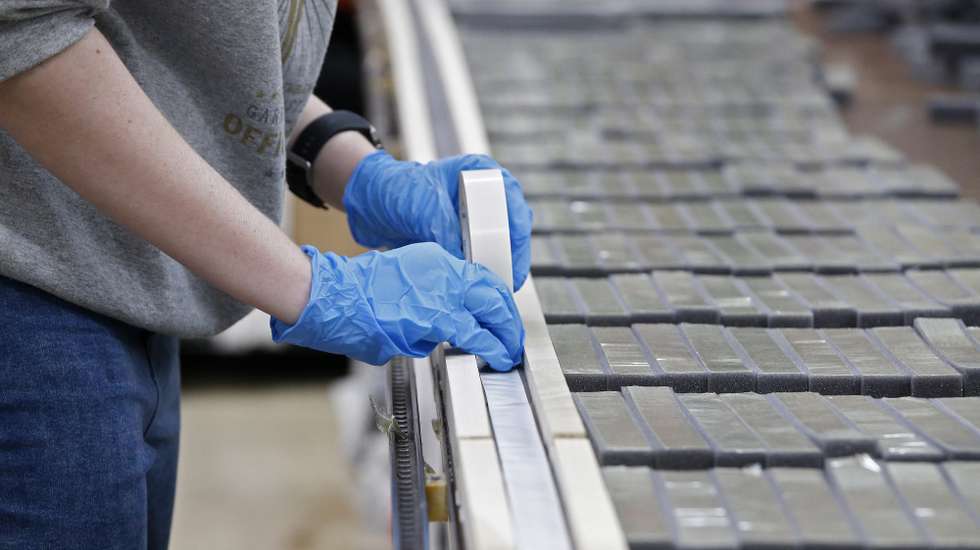 epa08332983 An employee works on the assembly line preparing the foam piece for medical face shields, in Garland, Texas, USA, 25 March 2020. Cut Form LLC, a full service production company specializing in high volume fabric cutting, started producing medical face shields for medical personnel around the country as a protective equipment against the coronavirus COVID-19.  EPA/LARRY W. SMITH