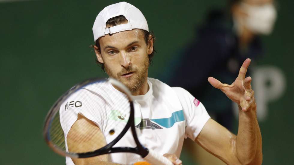 epa08706517 Joao Sousa of Portugal hits a forehand during his first round match against Andrej Martin of Slovakia at the French Open tennis tournament at Roland Garros in Paris, France, 29 September 2020.  EPA/YOAN VALAT