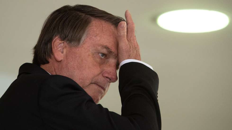 epa08871572 President of Brasil Jair Bolsonaro reacts during the launching of the program 'Saude con agente' (Health wit us) at Planalto Presidential Palace in Brasilia, Brazil, 08 December 2020. The program seeks better health indicators and basic attention to Brazilian people.  EPA/JoÃ©dson Alves