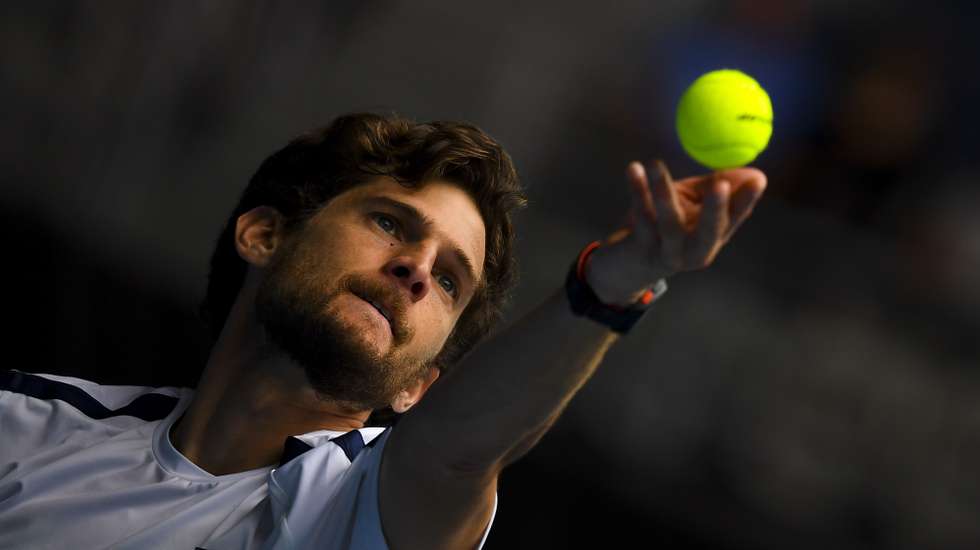 epa08995586 Pedro Sousa of Portugal in action during his first Round Men's singles match against Stan Wawrinka of Switzerland on Day 1 of the Australian Open Grand Slam tennis tournament at Melbourne Park in Melbourne, Australia, 08 February 2021.  EPA/JAMES ROSS  AUSTRALIA AND NEW ZEALAND OUT