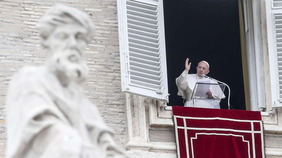 epa09073482 Pope Francis reciting the prayer of the Angelus from the window of his study overlooking Saint Peter's Square, Vatican City, 14 March 2021.  EPA/FABIO FRUSTACI