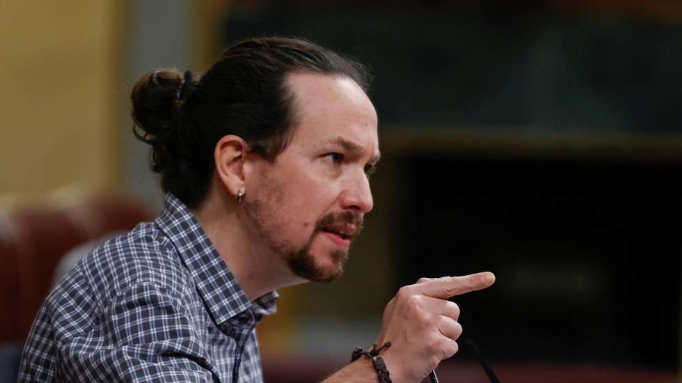epa09092988 Spanish second deputy Prime Minister Pablo Iglesias intervenes during a plenary session at the Lower House in Madrid, Spain, 24 March 2021. Spanish second deputy Prime Minister, Pablo Iglesias, will be attending question time for the last time as he will be resigning from his post in order to run for Madrid's regional Presidency in the oncoming regional elections, 04 May 2021.  EPA/CHEMA MOYA