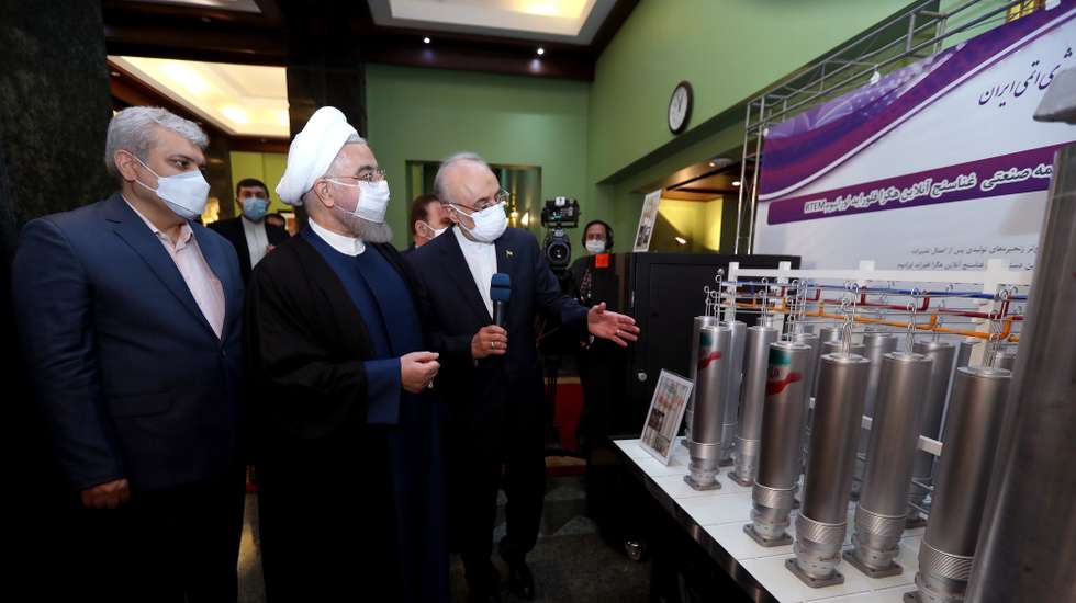 epa09126292 A handout picture made available by the Iranian presidential office shows Iranian President Hassan Rouhani (C) and head of Iran's nuclear organization Ali Akbar Salehi (R) visits an exhibition of nuclear achievement on the occasion of Iran Nuclear Technology Day, in Tehran, Iran, 10 April 2021. According to Isna news agency, Rouhani said that 'US and west owe us about nuclear deal and they must make it up', referring to the sanctions against the country over Iran's disputed nuclear programm.  EPA/IRAN PRESIDENT OFFICE HANDOUT  HANDOUT EDITORIAL USE ONLY/NO SALES