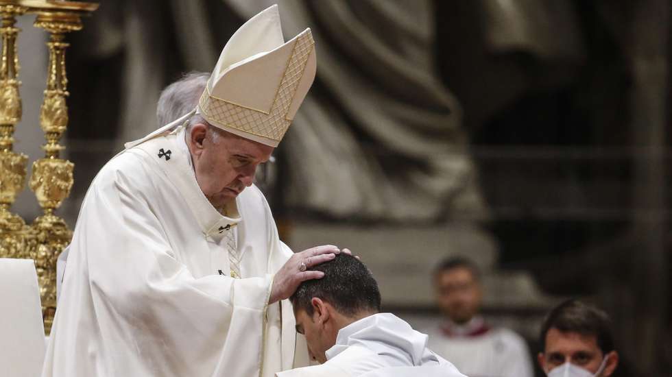 epa09157952 Pope Francis places his hands on the heads of the newly ordained priests, during a priestly ordinations ceremony held by Pope Francis inside the St. Peter's Basilica in Vatican, 25 April 2021.  EPA/FABIO FRUSTACI