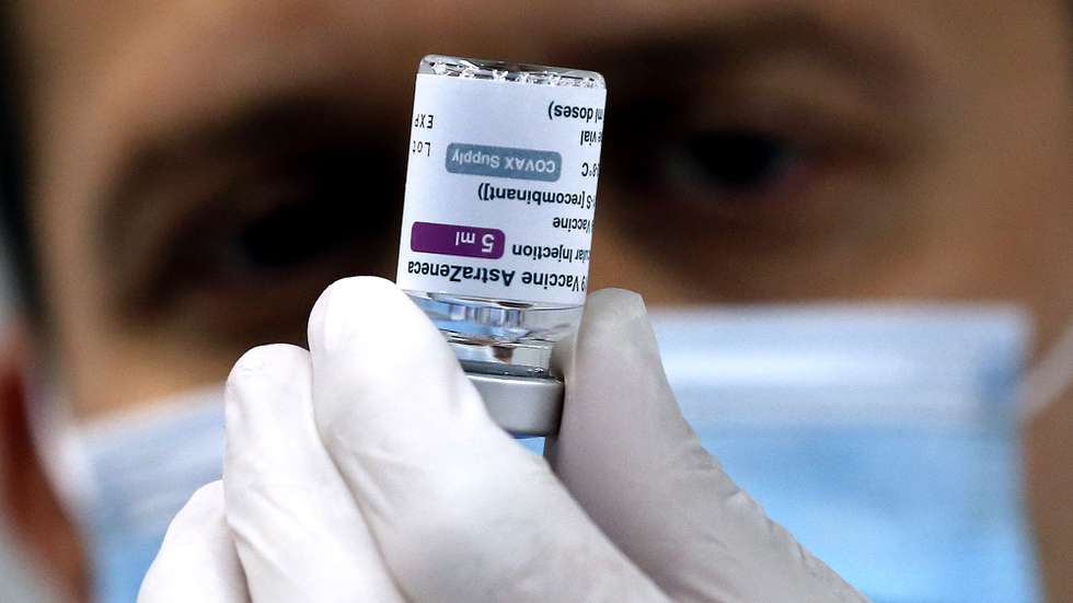 epa09149612 A medical worker prepares a dose of vaccine Vaxzevria (previously COVID-19 Vaccine AstraZeneca) during the beginning of the mass vaccination in the center at the 'Juan Antonio Samaranch' Olympic Hall in Sarajevo, Bosnia and Herzegovina, 21 April 2021. Sarajevo Kanton received more than 10,000 doses of vaccines for the vaccination of people in Sarajevo.  EPA/FEHIM DEMIR