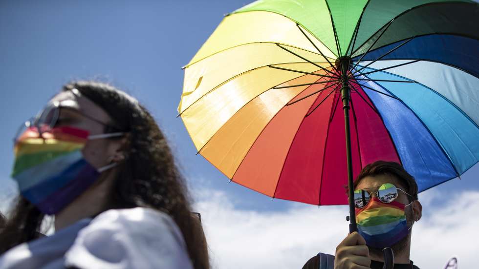 epa09285612 Members of the lesbian, gay, bisexual, transgender and queer (LGBTQ) community hold an umbrella with LGBTQI+ rainbow flag during a rally against Turkey's withdrawal from Istanbul Convention in Istanbul, Turkey, 19 June 2021. Turkish President Recep Tayyip Erdogan pulled Turkey out of the Istanbul Convention, which is an international accord designed to protect women, which was started by the Council of Europe in 2011 for the Prevention of Violence against Women and Domestic Violence, and is signed by 45 European countries as well as the EU as an organization.  EPA/ERDEM SAHIN