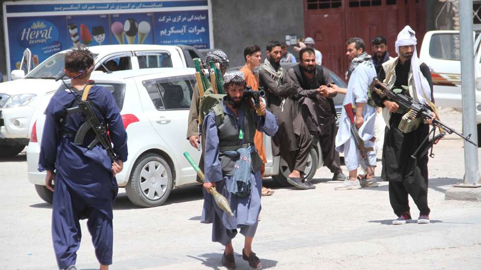epa09394567 Private militia loyal to Ismail Khan, the former Mujahideen commander patrols after security forces took back control of parts of Herat city following intense battle with Taliban militants, in Herat, Afghanistan, 04 August 2021. Heavy fighting continued in Kandahar, Lashkargah, and Herat cities as the Taliban continued pressing on with their sur?ge in Afghanistan and breaking through a tough resistance by the government forces. The fighting in Herat displaced hundreds of families as people lef?t their houses to seek refuge in central parts of the city, mostly settling with relatives.  EPA/JALIL REZAYEE