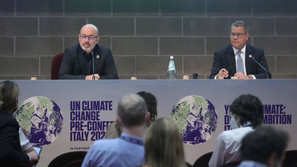 epa09501572 A handout photo made available by the PRE-COP26 meeting press office shows Italian Minister of Ecological Transition Roberto Cingolani (L) and British Minister Alok Sharma, President-designate of COP26, at the Mico congress center for the final press conference of the Youth4climate: driving ambition forum, in Milan, Italy, 02 October 2021.  EPA/PRE-COP26 MEETING PRESS OFFICE HANDOUT  HANDOUT EDITORIAL USE ONLY/NO SALES