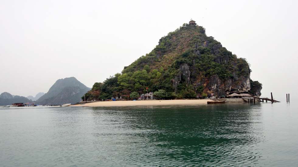 epa02589163 A view of Titop island, where nearby the tourist boat 'Dream Voyage' sunk, in Ha Long Bay, in northern Vietnam, 18 February 2011. Vietnamese police detained for questioning the captain and four crew members involved in a boat tragedy that left 12 tourists dead the previous day. The accident occurred on 17 February at Ha Long Bay when a tourist boat carrying 27 people sank. Nguyen Khuong Duy, a Vietnamese Australian, one of 15 survivors in the tragedy told local media the accident happened when people were still sleeping in the boat. Those on the top deck had time to escape before the boat sank.  EPA/LUONG THAI LINH